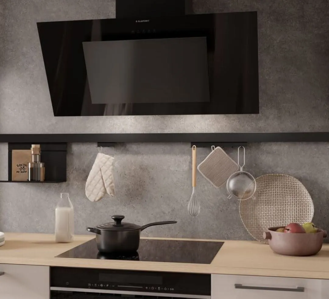 Close-up of a black extractor and hob in a Kundi kitchen
