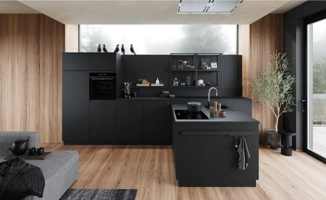 A soft black handleless kitchen with wood panelling